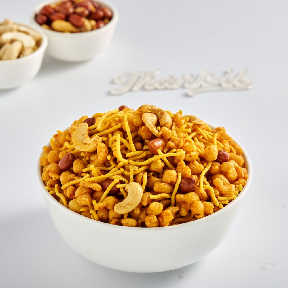 A selection of savoury snacks in ceramic bowls